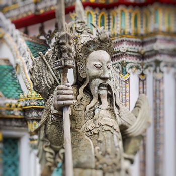 Statue of a Chinese warrior near an entrance of Wat Pho. Wat Pho is a Buddhist temple complex in the Rattanakosin district of Bangkok.