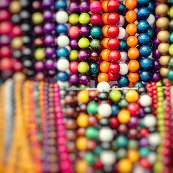 Wooden colored beads on display on the market in Zakopane, Poland 