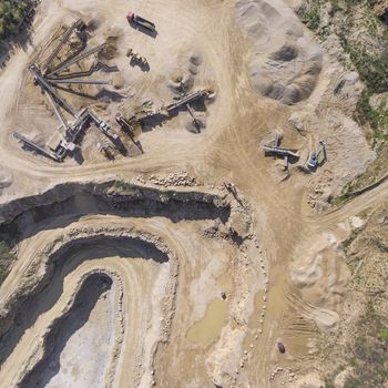 Mining quarry with special equipment, open pit excavation. Sand mine. View from above.