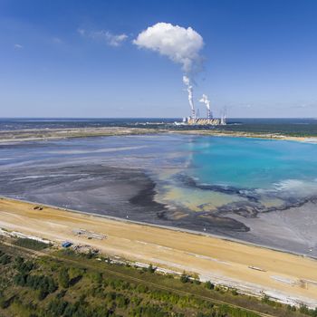 Surface coal mining and power station in Poland. Destroyed land. View from above. Surrealistic landscape.