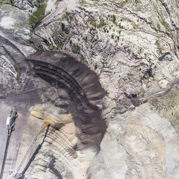 Surface coal mining in Poland. Destroyed land. View from above. Surrealistic landscape.