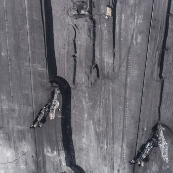 Surface coal mining in Poland. Destroyed land. View from above. Surrealistic landscape.