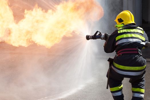 Fireman fighting fire during training