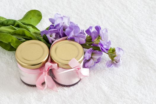 jars of natural powder pink and purple flowers