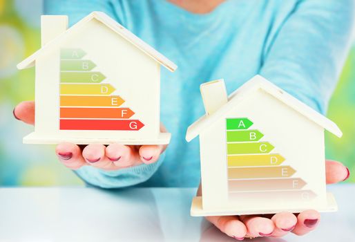 concept comparison between normal house and low consumption house with energy efficiency rating