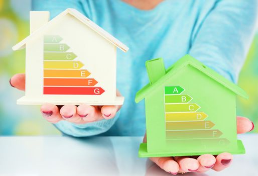 concept comparison between normal house and low consumption house with energy efficiency rating