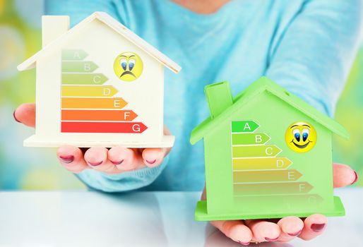 concept comparison between normal house and low consumption house with energy efficiency rating