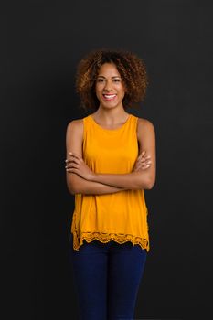 Beautiful African American woman standing with hands folded