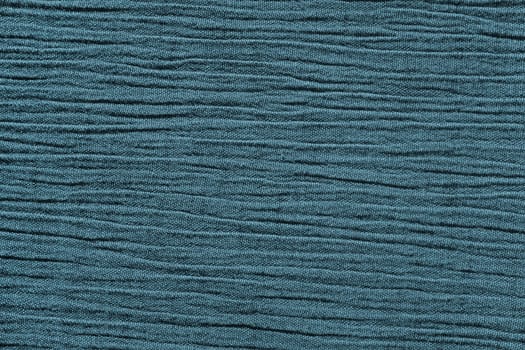 Blue crinkled material with irregular horizontal lines fabric abstract background texture