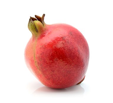 Fresh Indian pomegranate on a white background