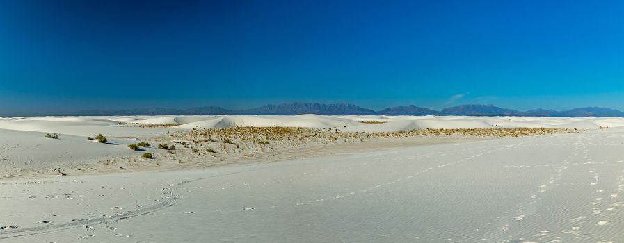 White Sands National Monument is in the northern Chihuahuan Desert in the U.S. state of New Mexico. It's known for its dramatic landscape of rare white gypsum sand dunes, and is the largest dune field of its kind in the world.