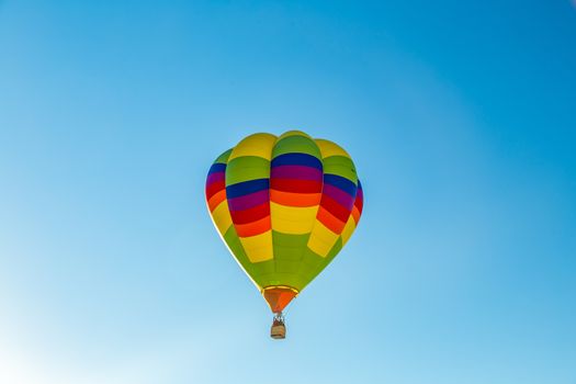 Colorful hot air balloons fly over the glistening gypsum dunes at White Sands National Monument during the 2016 Balloon Invitational.