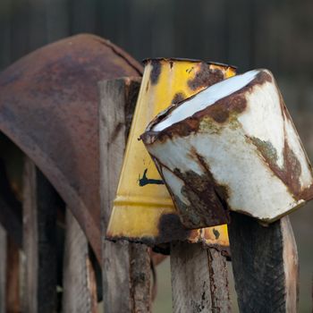 Old wooden boundary fence with nails on sunny day
