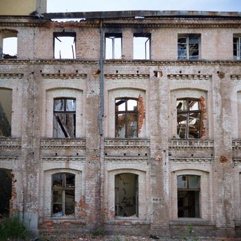 discarded ruin with old windows and wall, industrial window in concrete wall