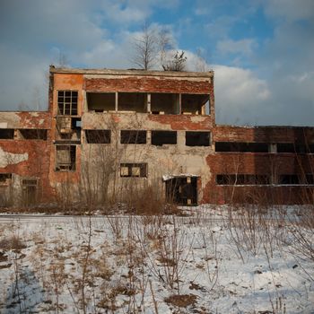 discarded ruin with old windows and wall, industrial window in concrete wall