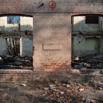 discarded ruin with old windows and wall, industrial window in concrete wall