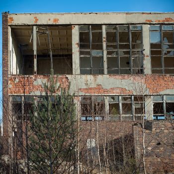 discarded ruin with old windows and wall, industrial window in concrete wall