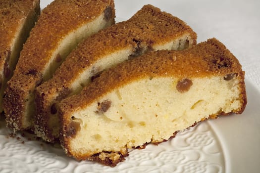 Curd cake with raisins and ruddy crust slices macro shot