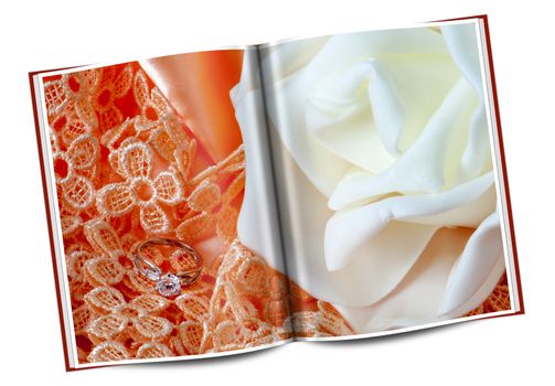 book of  wedding rings on  a colorful fabric background