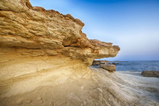 by erosion affected rocks by the sea on the coast of Cyprus