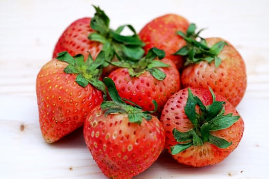 Close Up Red Strawberry Group on the Table Wood