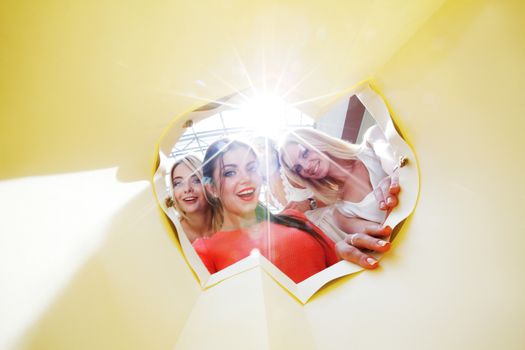 beautiful young women looking inside bag