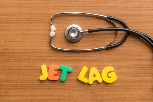 jet lag colorful word with Stethoscope on wooden background