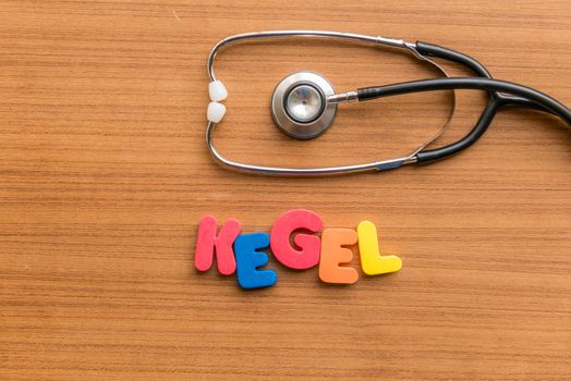 Kegel colorful word with Stethoscope on wooden background