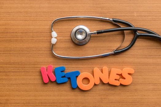 ketones colorful word with Stethoscope on wooden background