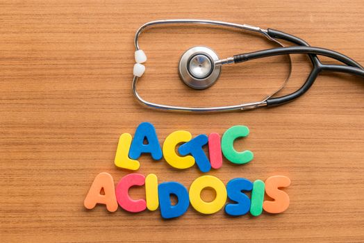 lactic acidosis colorful word with Stethoscope on wooden background
