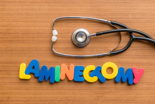 laminectomy colorful word with Stethoscope on wooden background