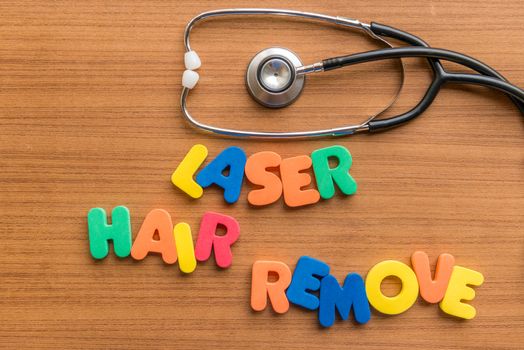laser hair remove colorful word with Stethoscope on wooden background