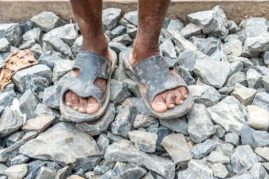 Gopalgonj, Bangladesh - September 19, 2016: Legs of a labor with muddy at Gopalgonj, Bangladesh