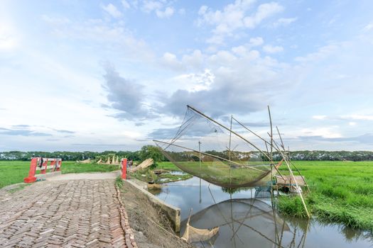 Gopalgonj, Bangladesh - September 18, 2016: fishnet with fisherman at Gopalgonj, Bangladesh