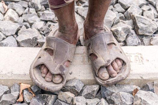 Gopalgonj, Bangladesh - September 20, 2016: Legs of a labor with muddy at Gopalgonj, Bangladesh
