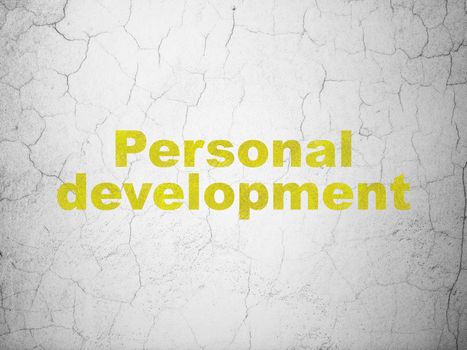 Studying concept: Yellow Personal Development on textured concrete wall background