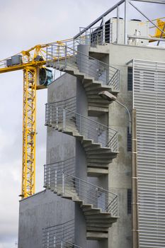 the construction crane and the building against the blue sky, France