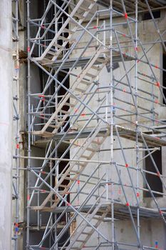 Extensive scaffolding providing platforms, work in progress on new apartment block, France