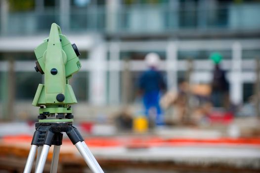 Surveyor equipment theodolite on tripod at building area, France