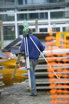 Surveyor equipment theodolite on tripod at building area, France