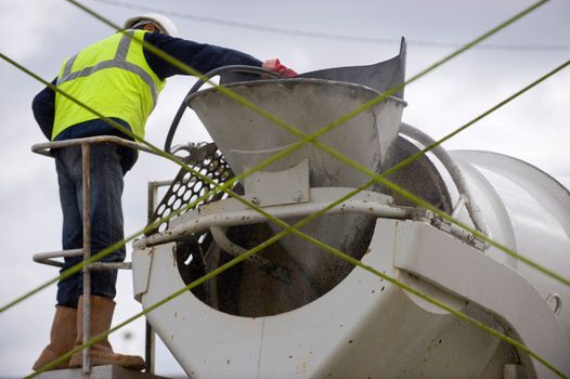 Worker and Truck with cement mixer, France