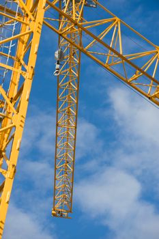 the construction crane and the building against the blue sky, France
