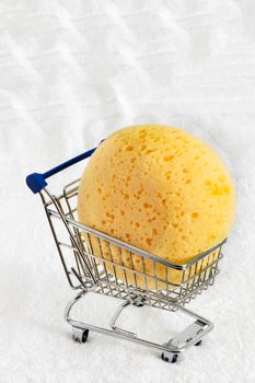 a yellow  sponge  on a  white background