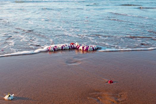 Garland on the beach at the ocean
