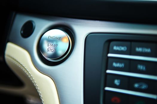 Start stop engine modern new car button.
