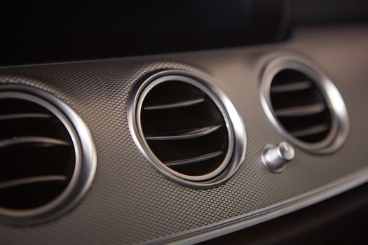 modern car interior, air conditioning hole. Close up