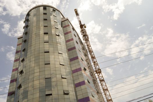 Building with a glass facade under construction in the city of Mombasa, Kenya