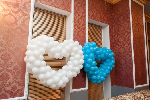 two hearts of balloons decoration for a wedding in the restaurant.