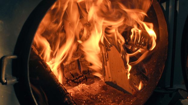 Wood burning in the stove. Fire close up.