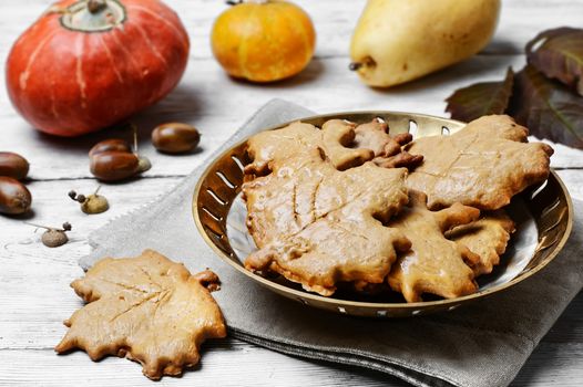 Cookies in the shape of maple autumn leaf in the autumn decoration